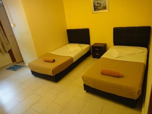 Eight Mentigi Guesthouse Cameron Highlands Kamer foto